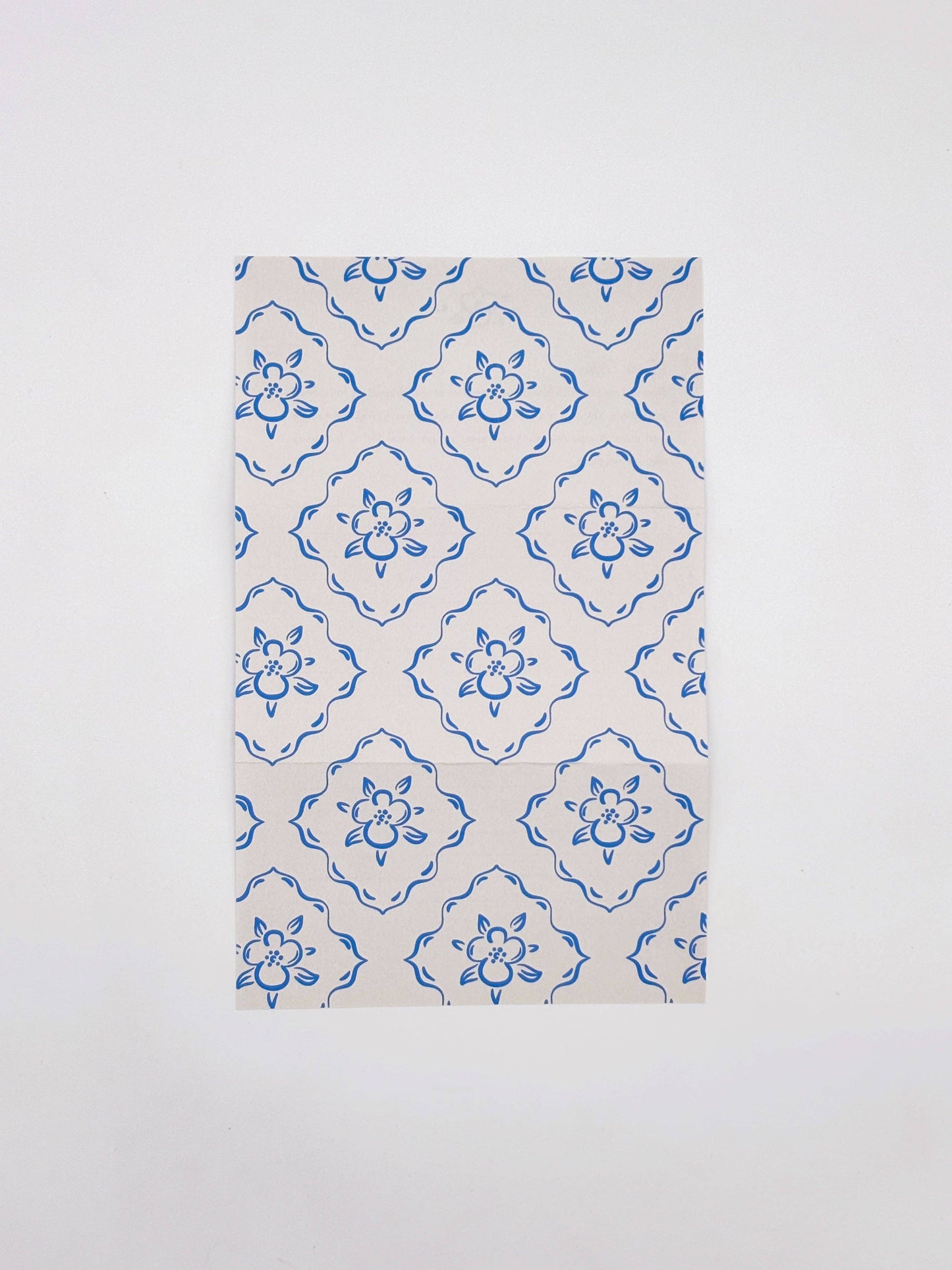 Fabric with blue floral pattern on a white background
