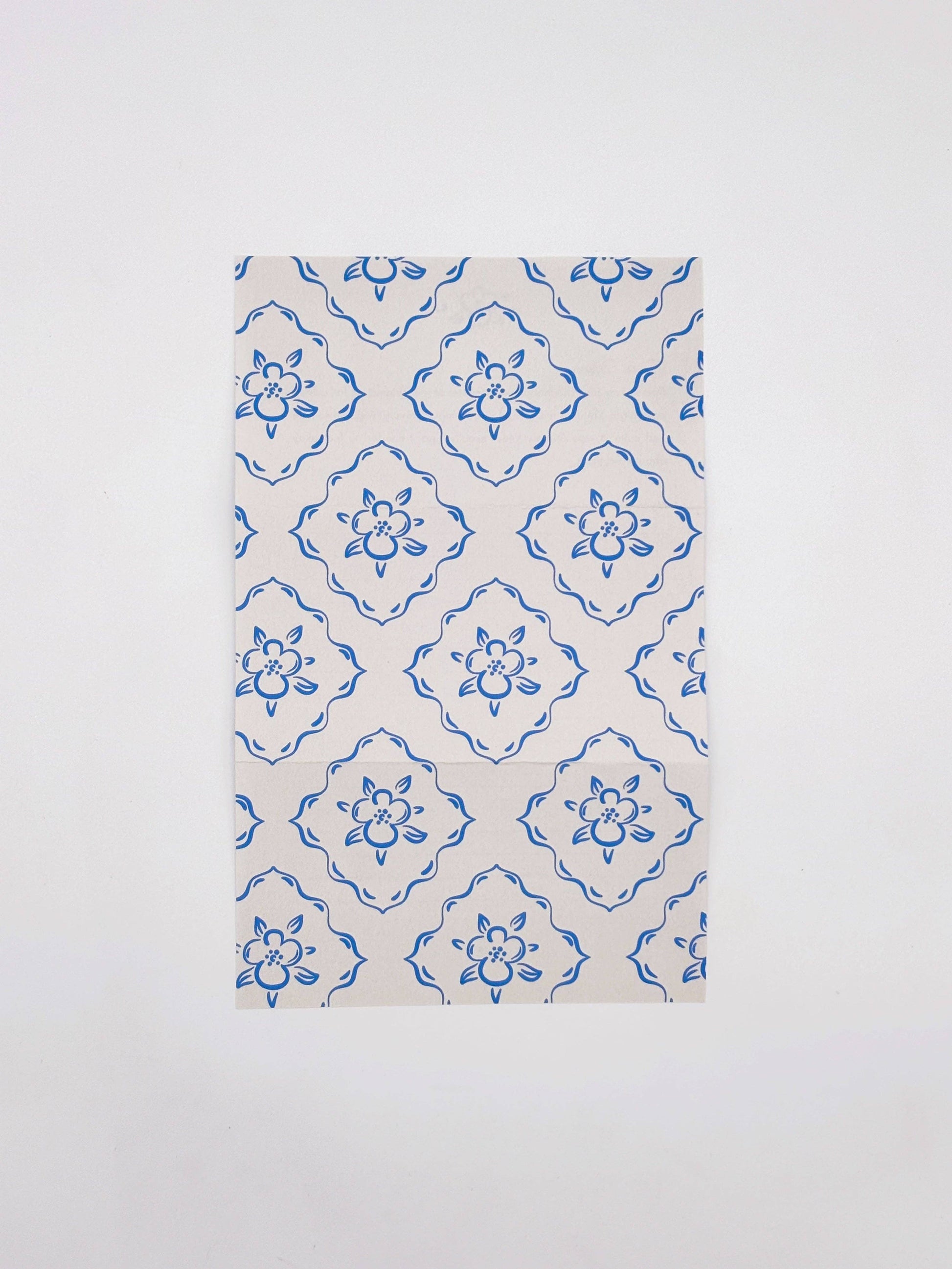 Fabric with blue floral pattern on a white background
