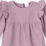Close-up mauve eyelet romper with ruffled sleeves on a white background