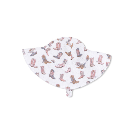 Baby sun hat with cowboy boot pattern on a white background