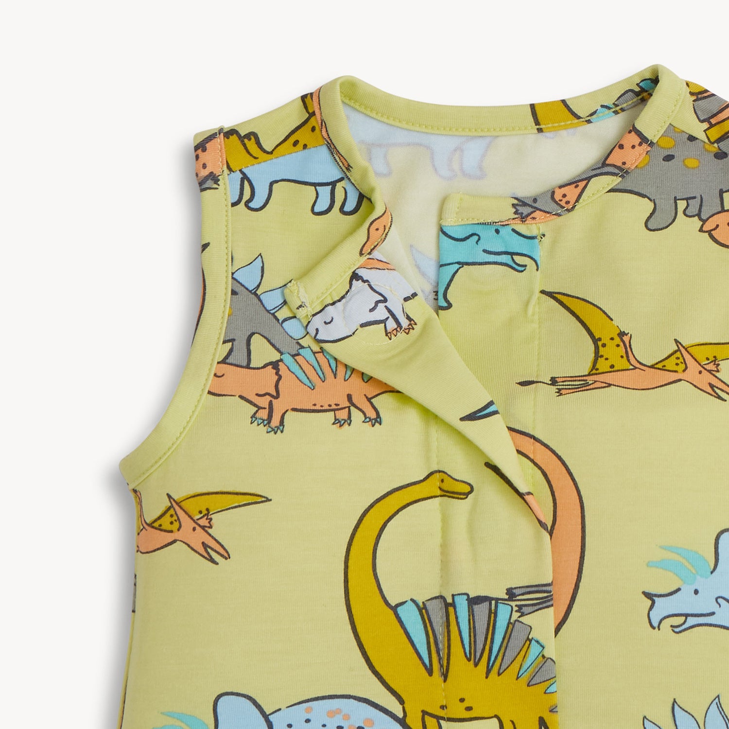 baby sleeveless romper with dinosaur pattern on a light yellow background