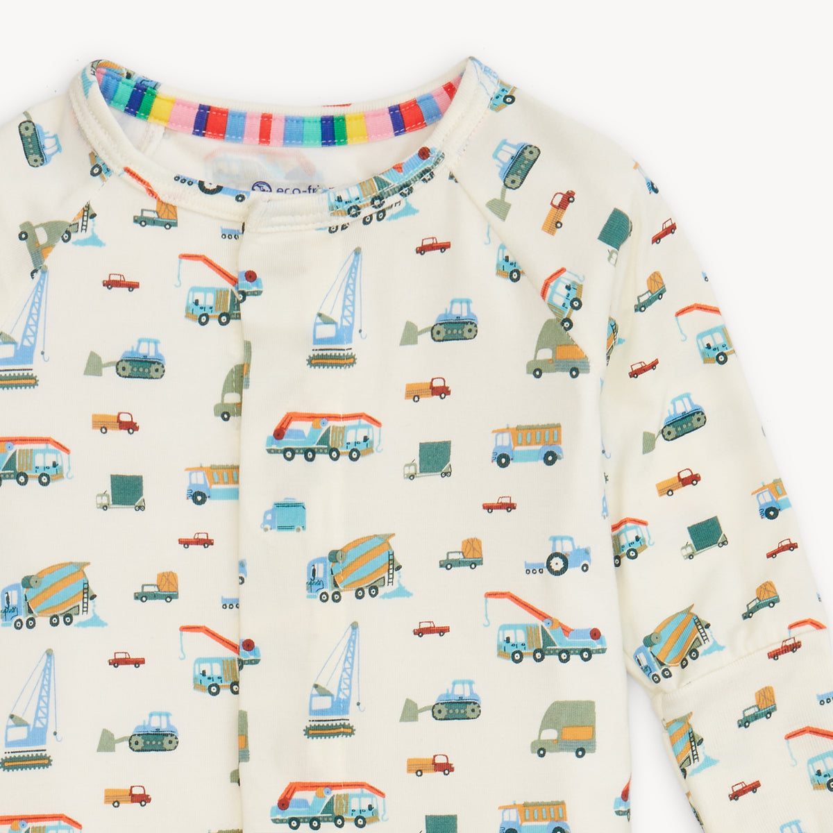 Infant coverall with colorful truck pattern on a white background