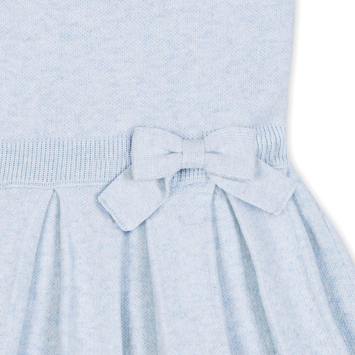 Light blue dress with a bow detail on a white background
