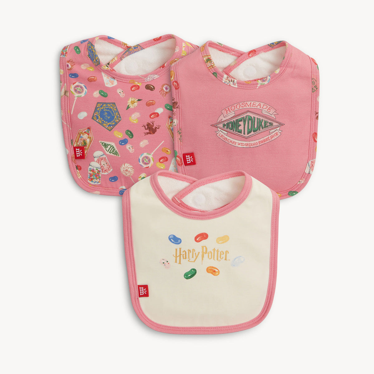 Three Harry Potter-themed baby bibs on a white background