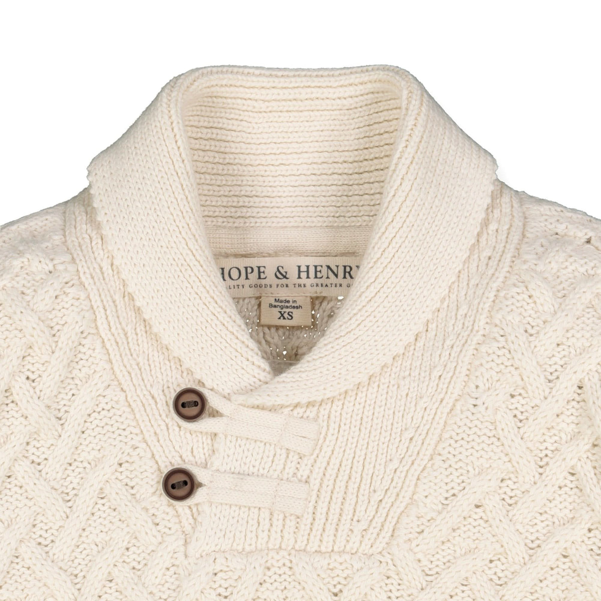 Close-up of a cream-colored knit sweater with buttons, featuring the brand 'Hope & Henry'.