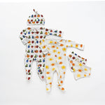 Baby clothing set with colorful patterns on a white background