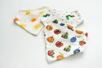 Three baby bibs with colorful fruit, vegetable, and sun patterns on a white background