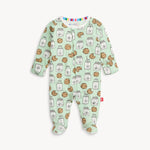 Children's onesie with cookie and milk pattern on a light green background
