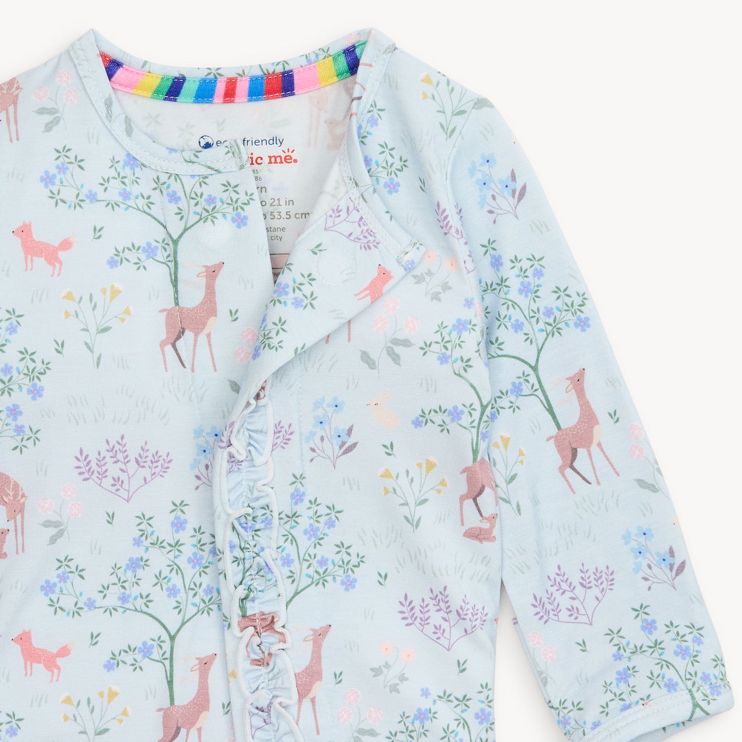 baby footie with deer and floral pattern on a light blue background