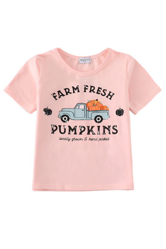 A short sleeve pink t-shirt with 'Farm Fresh Pumpkins' text and a graphic of a truck with pumpkins on it.