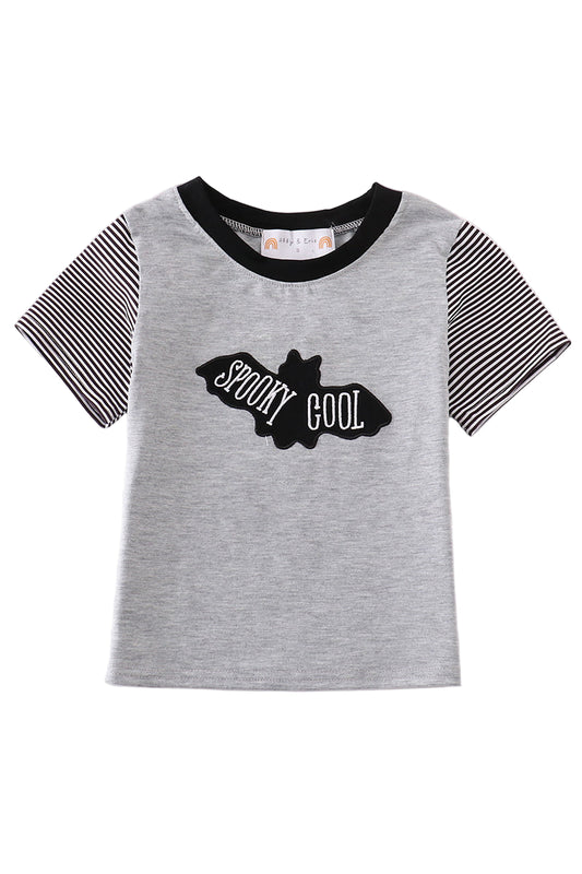 A short-sleeved gray t-shirt with black stripes on the sleeves and a graphic that reads 'SPooky COOL' with a bat silhouette.