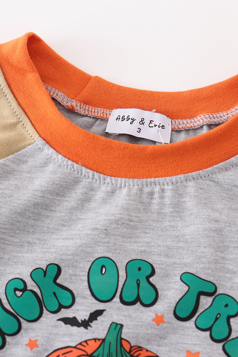 Children's shirt with 'Halloween' text and brand label on a plain background