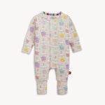 Baby coverall with colorful boba tea on a plain background