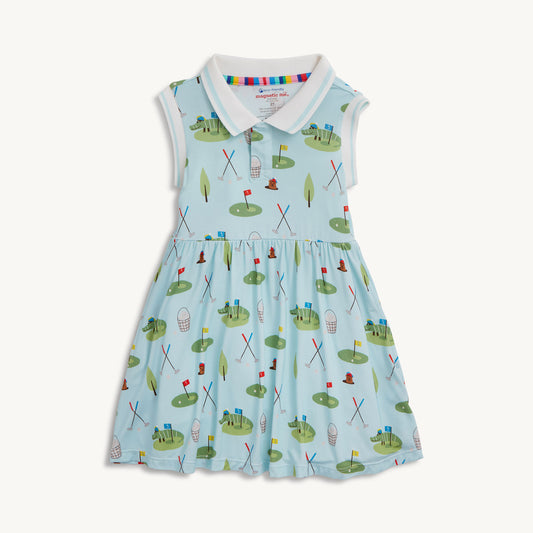 Children's dress with golf course pattern on a white background