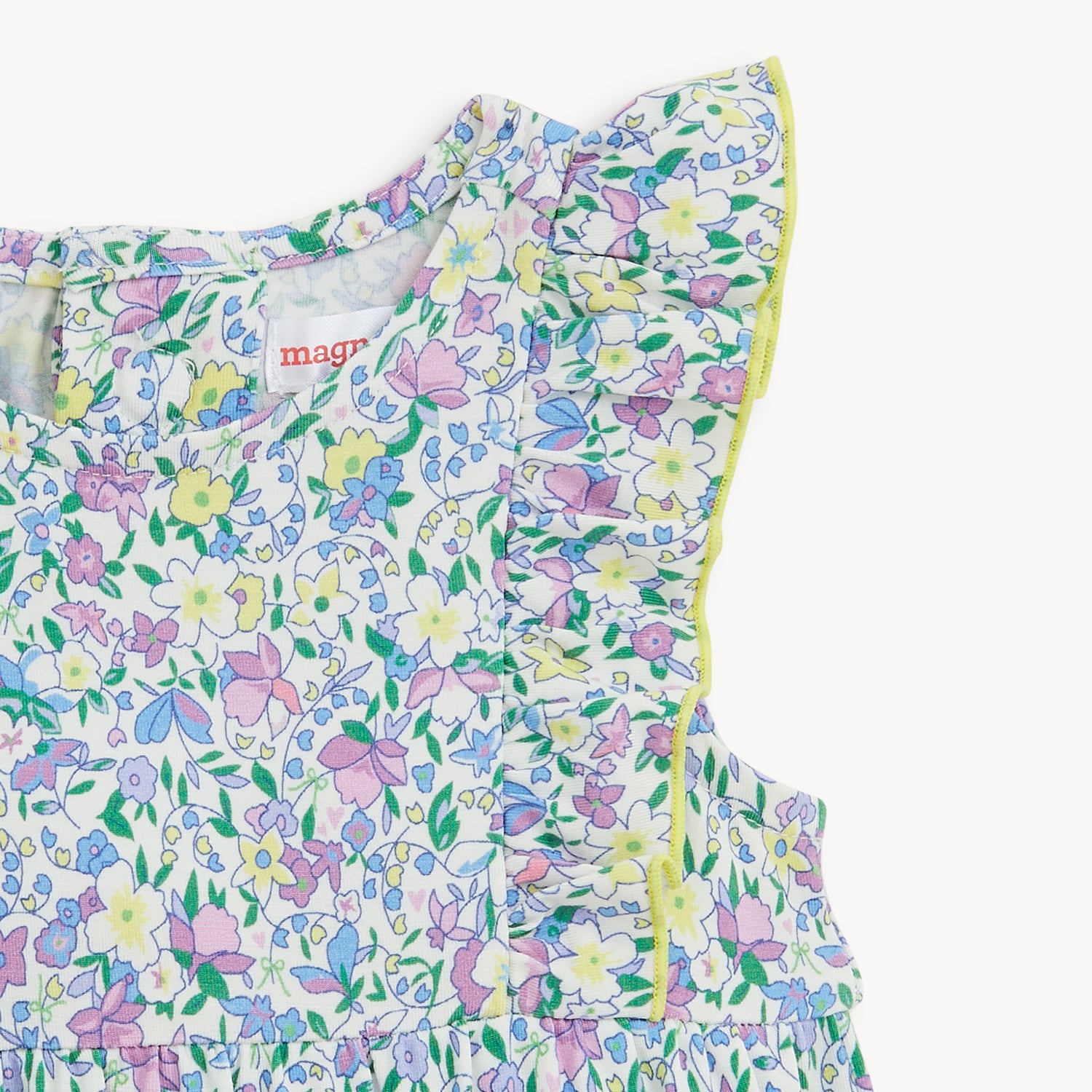Floral-patterned baby romper ruffle sleeve on a white background