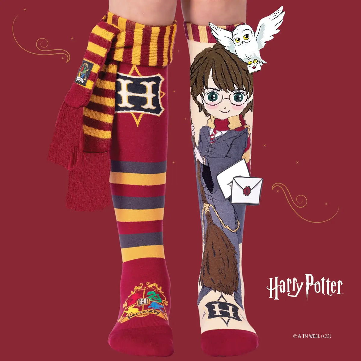 Harry Potter-themed socks with character design and Hogwarts scarf on a red background