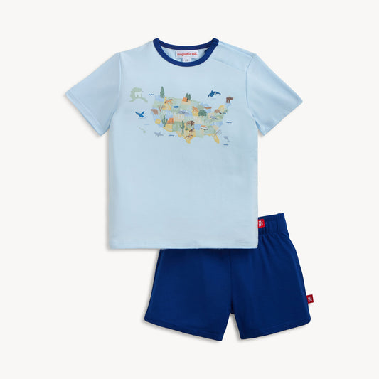 Children's light blue t-shirt with map design and navy shorts on a white background