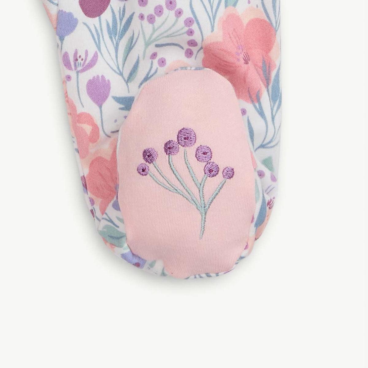 Floral-patterned product with a pink embroidered design on a white background
