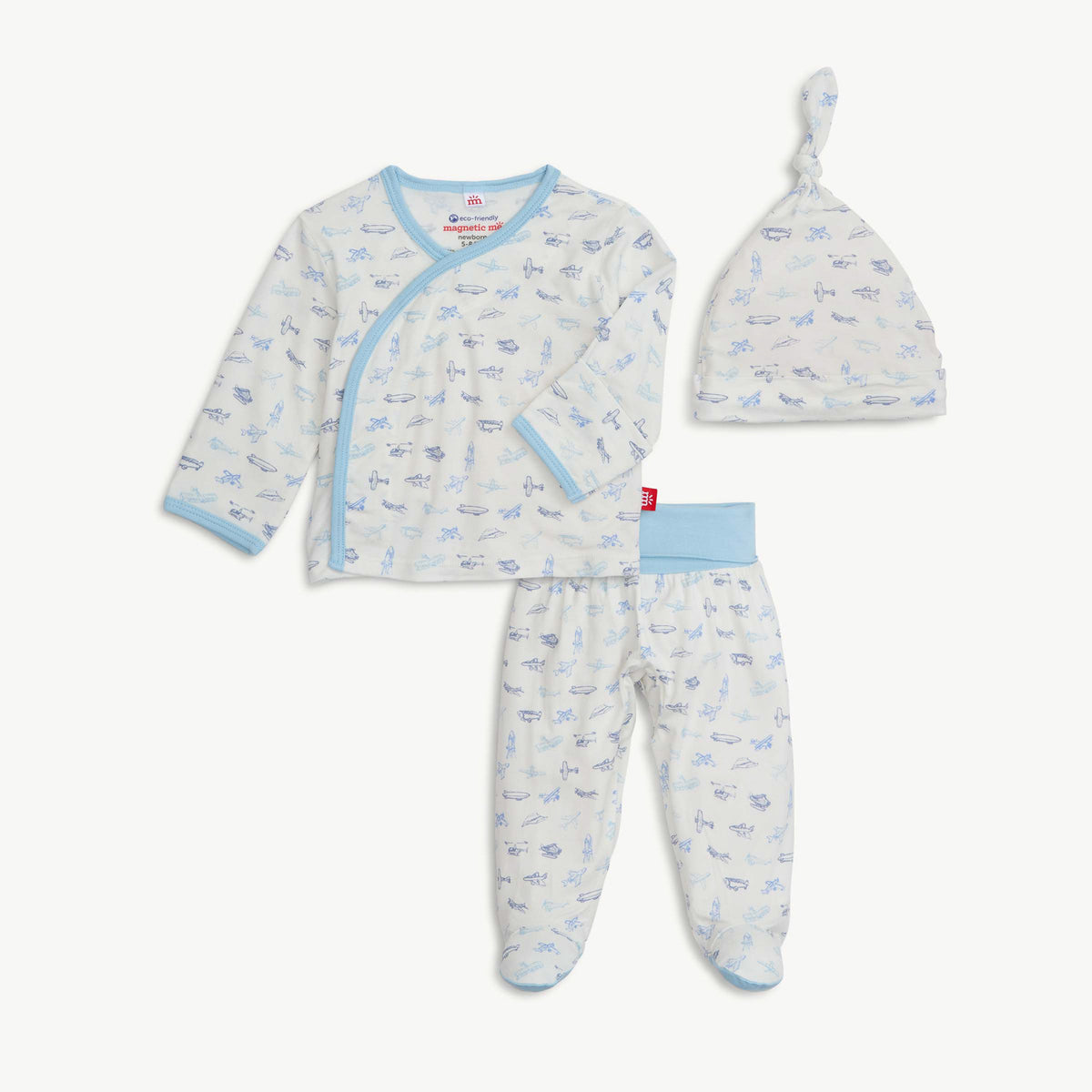 Baby outfit set with long-sleeve shirt, pants, and hat on a white background