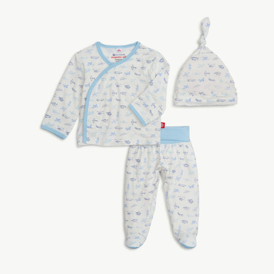 Baby outfit set with long-sleeve shirt, pants, and hat on a white background