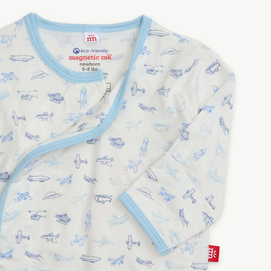 Baby wrap with airplane pattern and blue trim on a white background