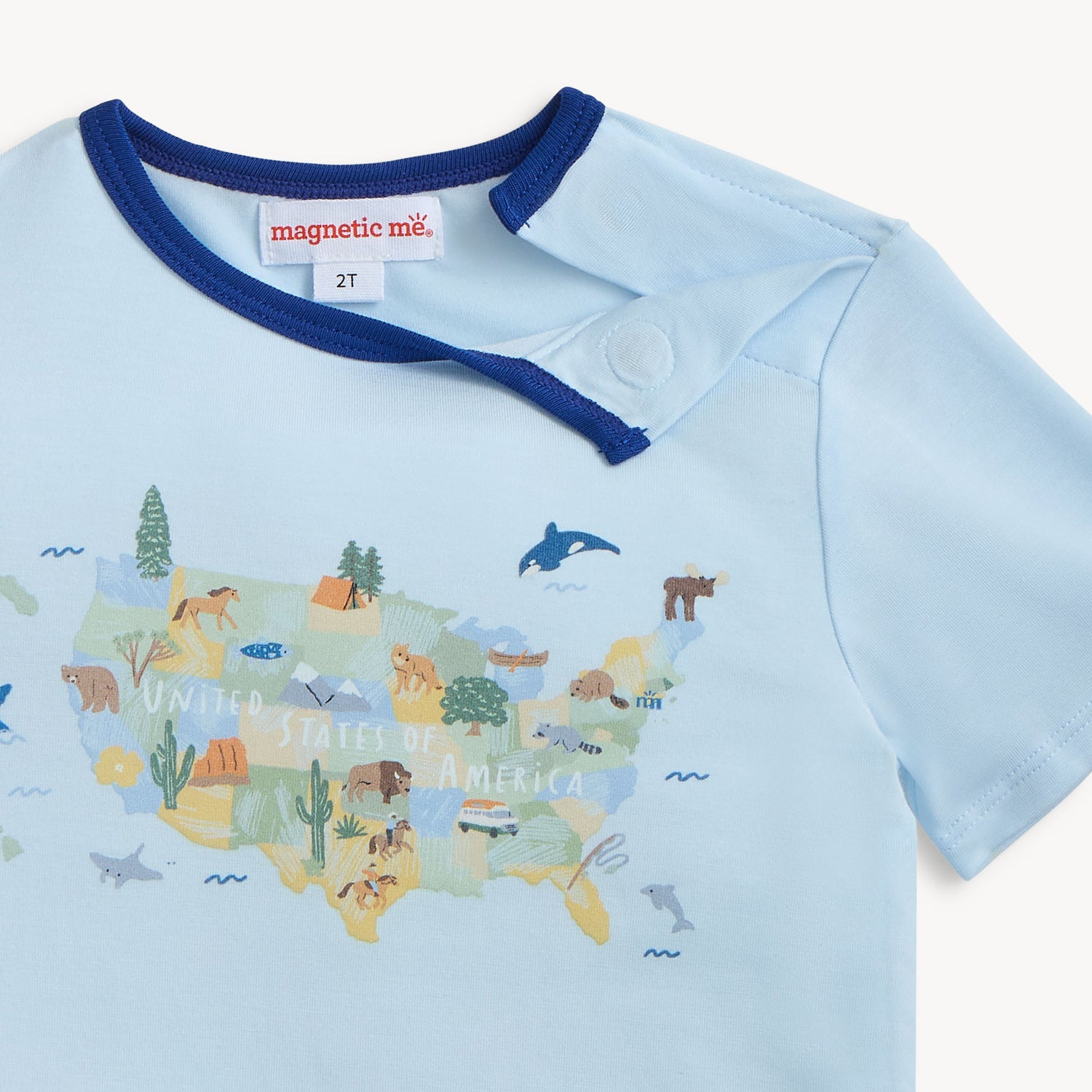 Light blue shirt with USA map and animals design on a white background