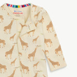 Baby footie closure with giraffe pattern on a white background