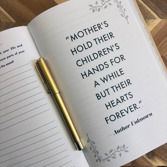 Open notebook with a quote about mothers and children on a wooden surface