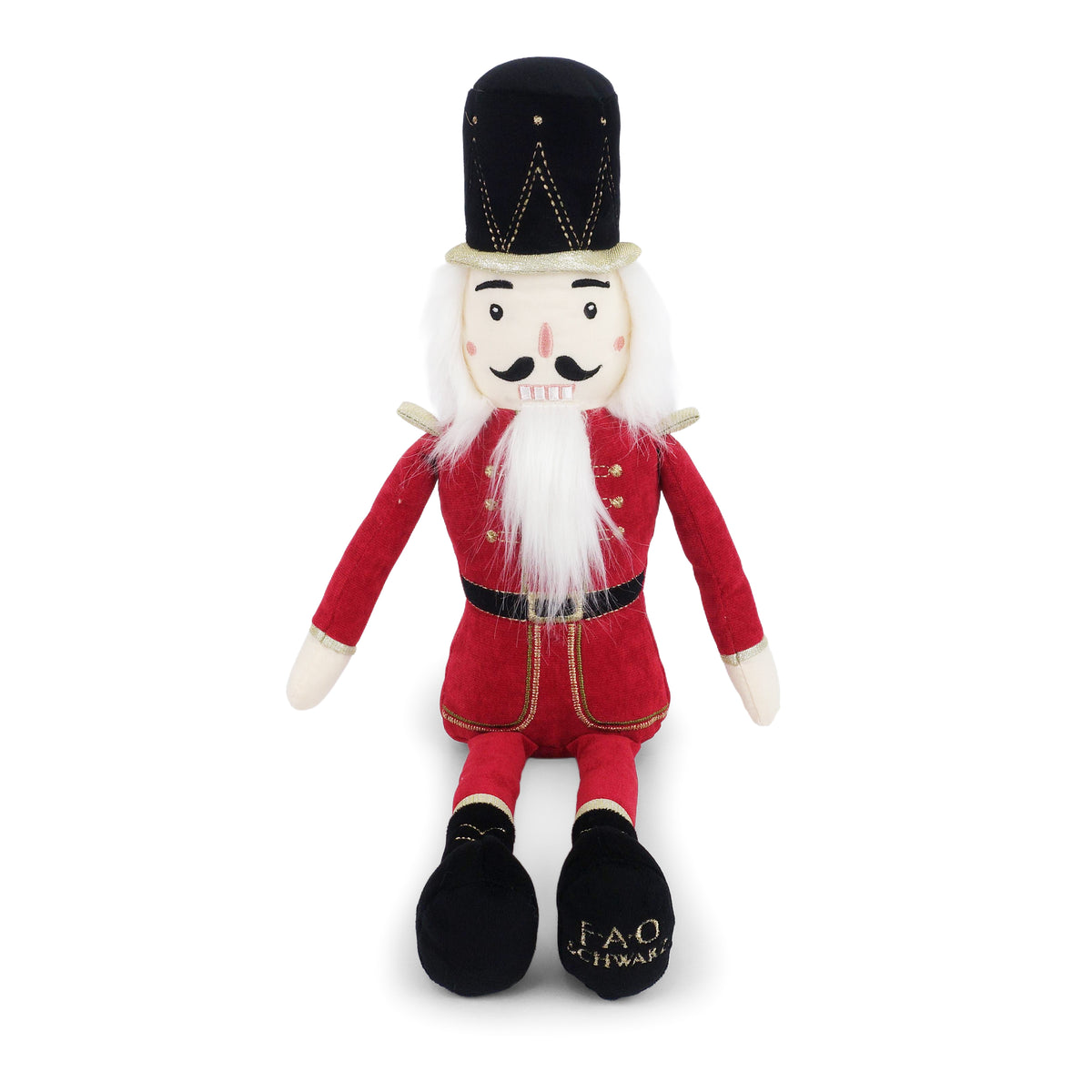 Plush toy resembling a nutcracker in red outfit with black hat on a white background