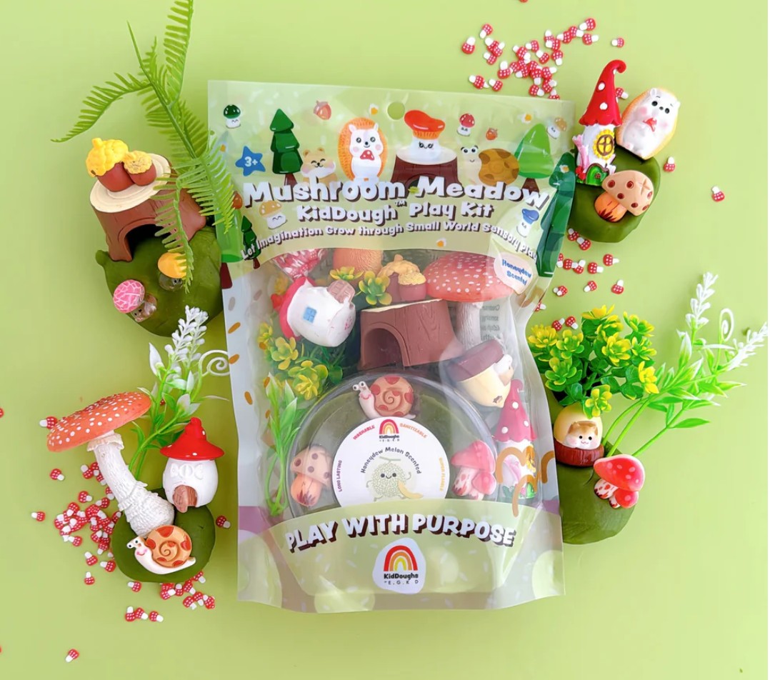 Mushroom Meadow Kid dough play kit packaging with toy figures on a green background