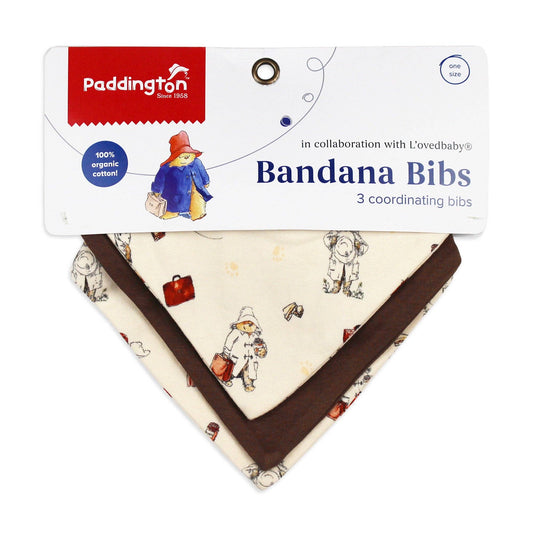 Packaged bandana bibs with Paddington Bear design on a white background