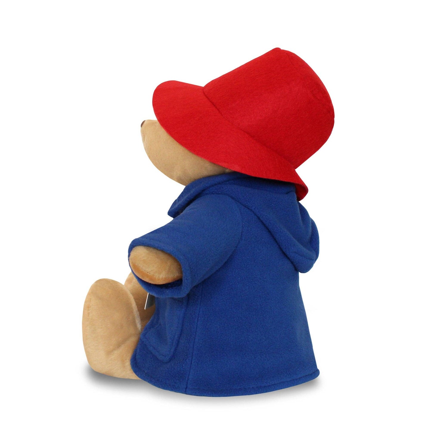 Stuffed bear toy wearing a blue coat and red hat on a white background