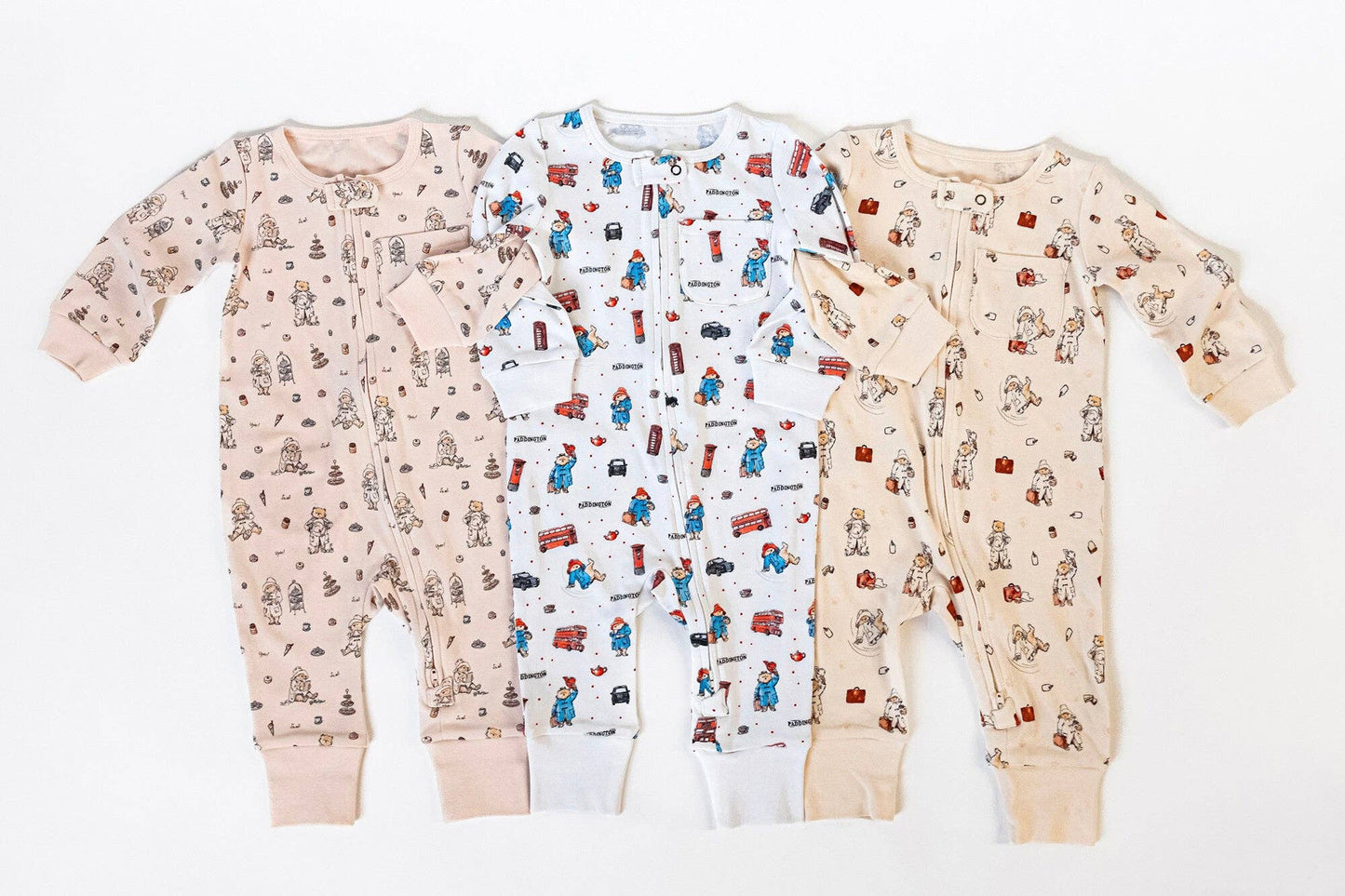 Three Paddington bear romper patterns on a white background