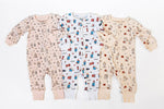 Three Paddington bear romper patterns on a white background