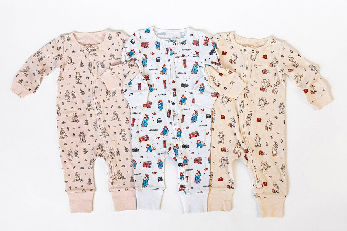 Three Paddington bear romper patterns on a white background