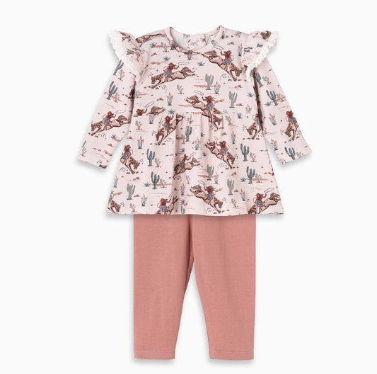 Children's outfit with a bucking horse patterned top and pink pants on a white background