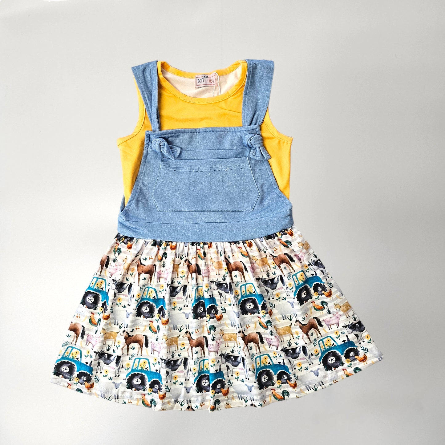 Two piece dress set for girls. Farm print with a yellow shirt.