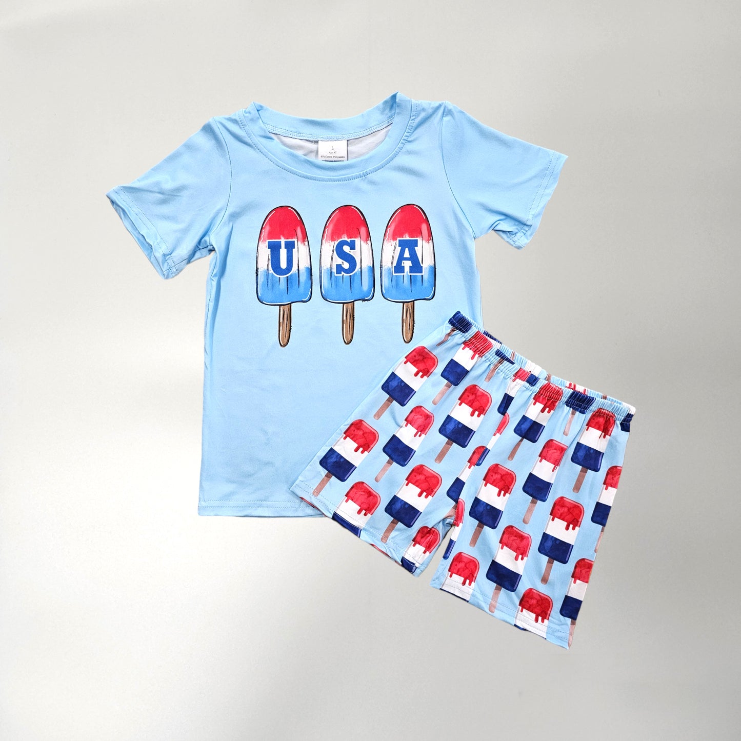 Boy red, white, blue two piece shorts set. Popsicle print design.