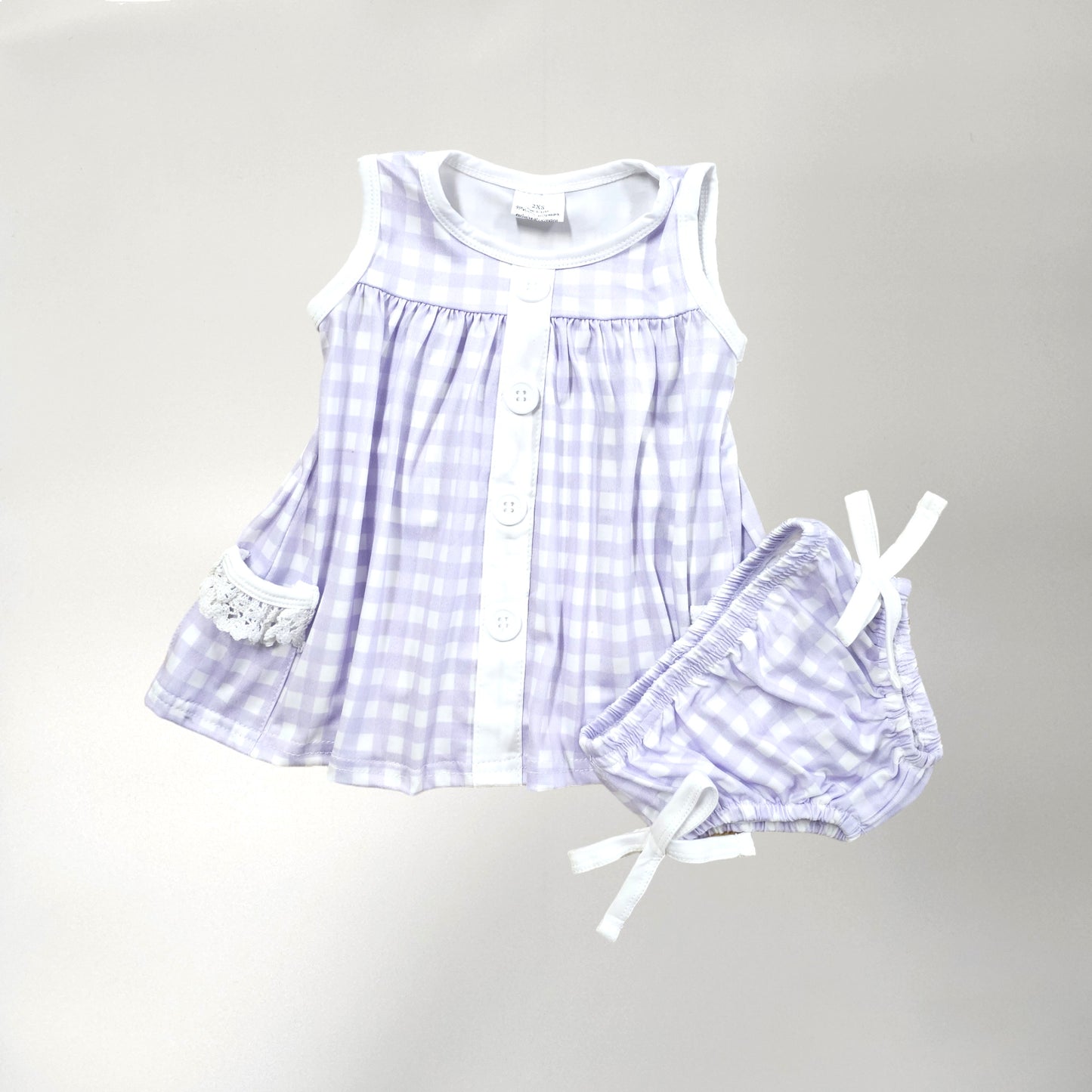 Light purple and white with lace and bows, two piece infant set. Fabric gingham check design