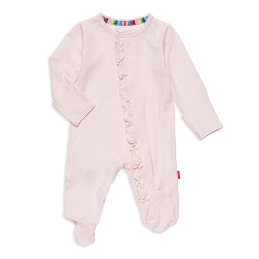 Pink baby onesie with ruffles on a white background