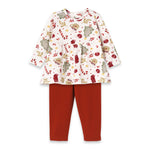 A set of baby girl clothing that includes a Christmas-themed bamboo top and red leggings.