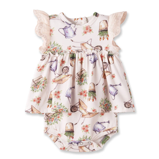 Baby romper with gardening-themed print on a white background