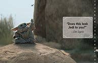 Baby Yoda sitting on a rock with a book titled 'Does this book jolt you?' by Jon Klassen.