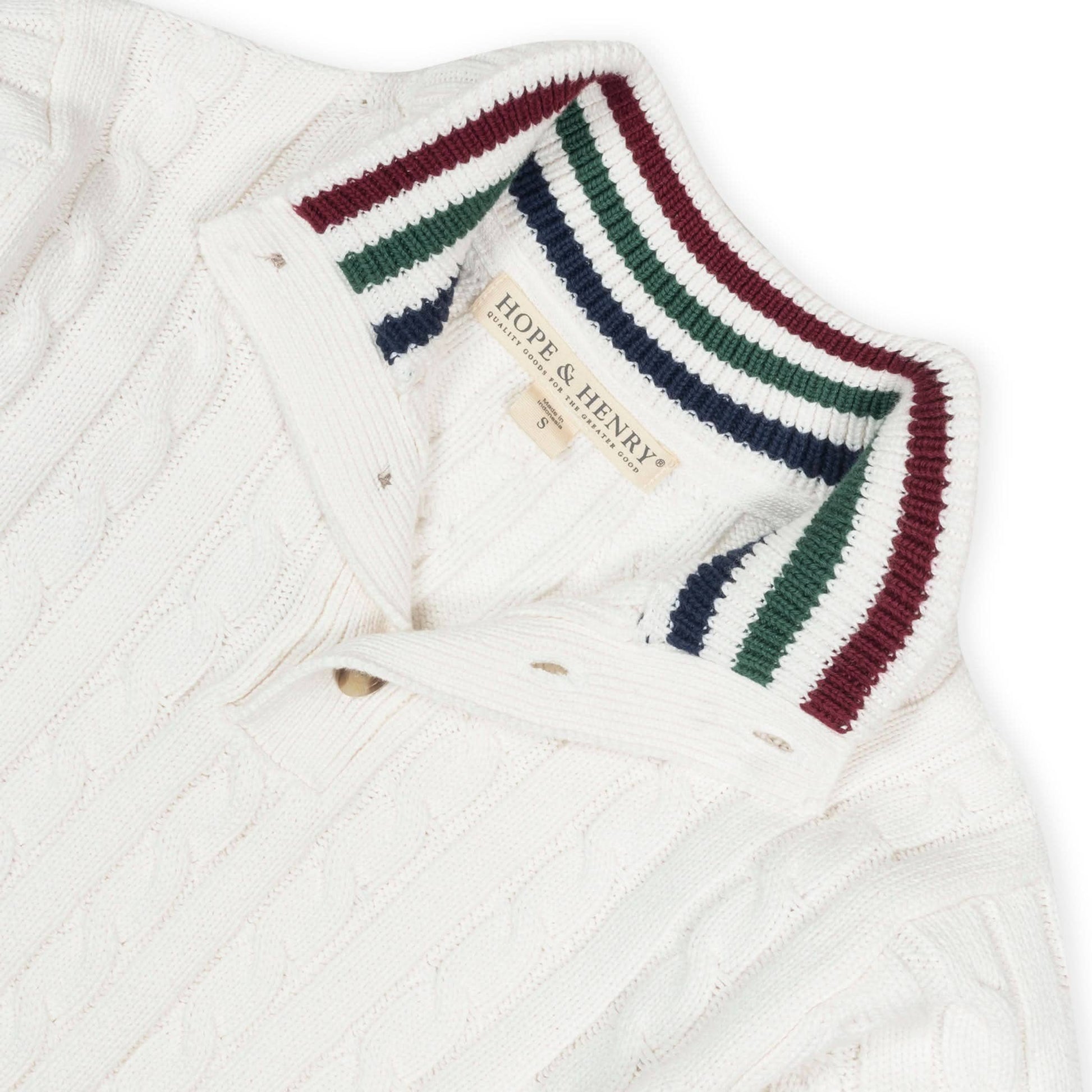 White cable knit sweater with striped collar on a white background, featuring the Hope & Henry brand.
