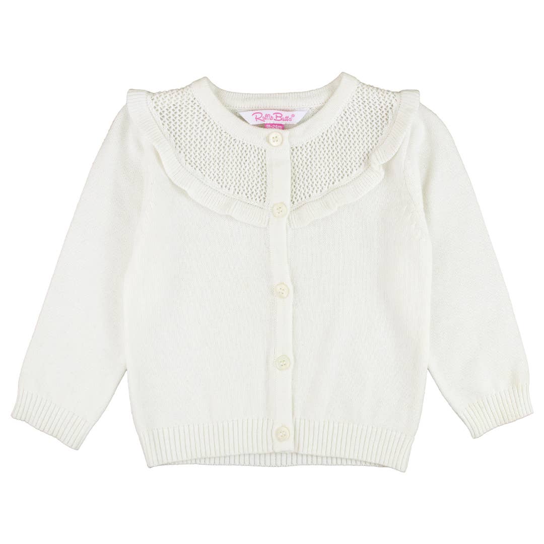 White cardigan with button details on a white background