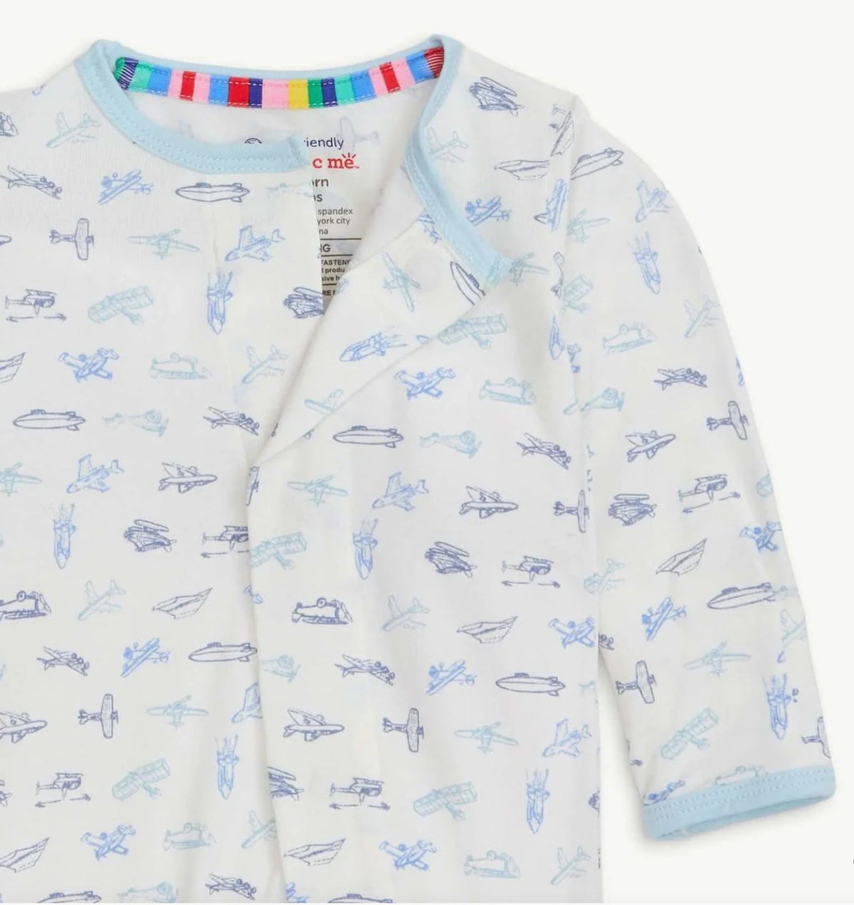 Baby onesie with airplane pattern on a white background