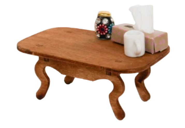 Wooden table with decorative items on a beige background