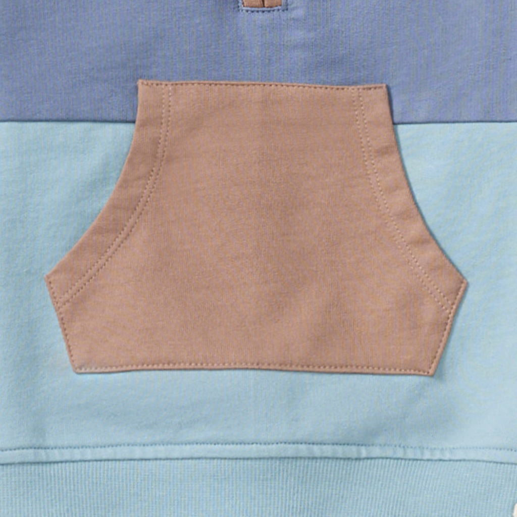 Close-up of a brown pocket on a blue fabric background