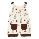back of baby overalls with Paddington bear pattern on a white background