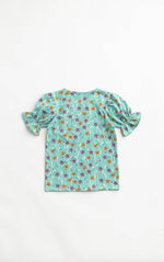 Floral-patterned top on a white background